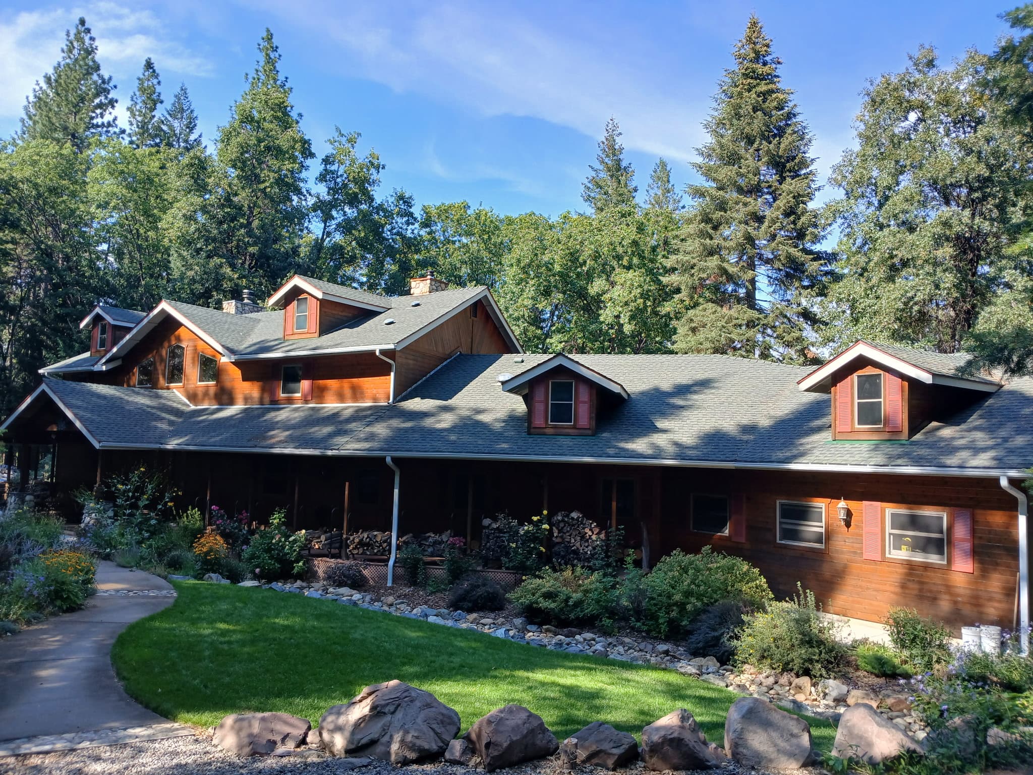 Large multi-dormer mountain estate with seamless gutters in Whitmore